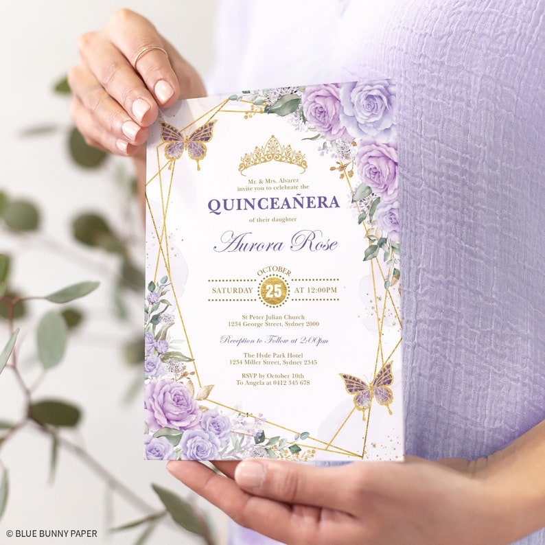 May include: Purple and gold Quincea&ntilde;era invitation with a floral design and a butterfly. The invitation includes the date, time, and location of the event. It also includes the name of the celebrant, Aurora Rose.