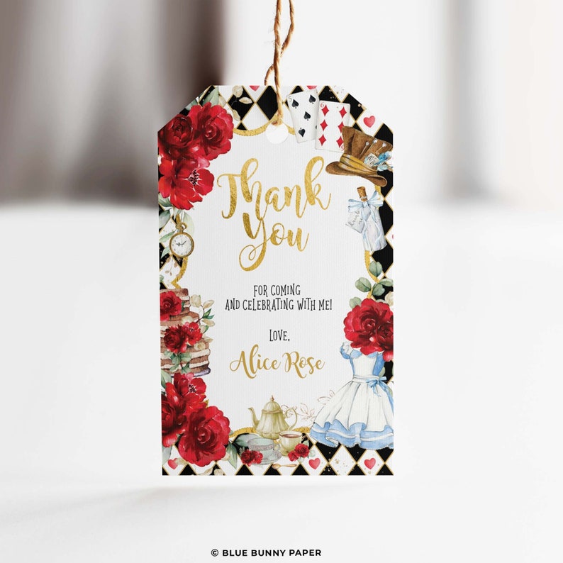 May include: A white thank you tag with a gold border and a watercolour illustration of Alice in Wonderland characters. The text reads "Thank You" in gold lettering, "For coming and celebrating with me!" and "Love, Alice Rose".