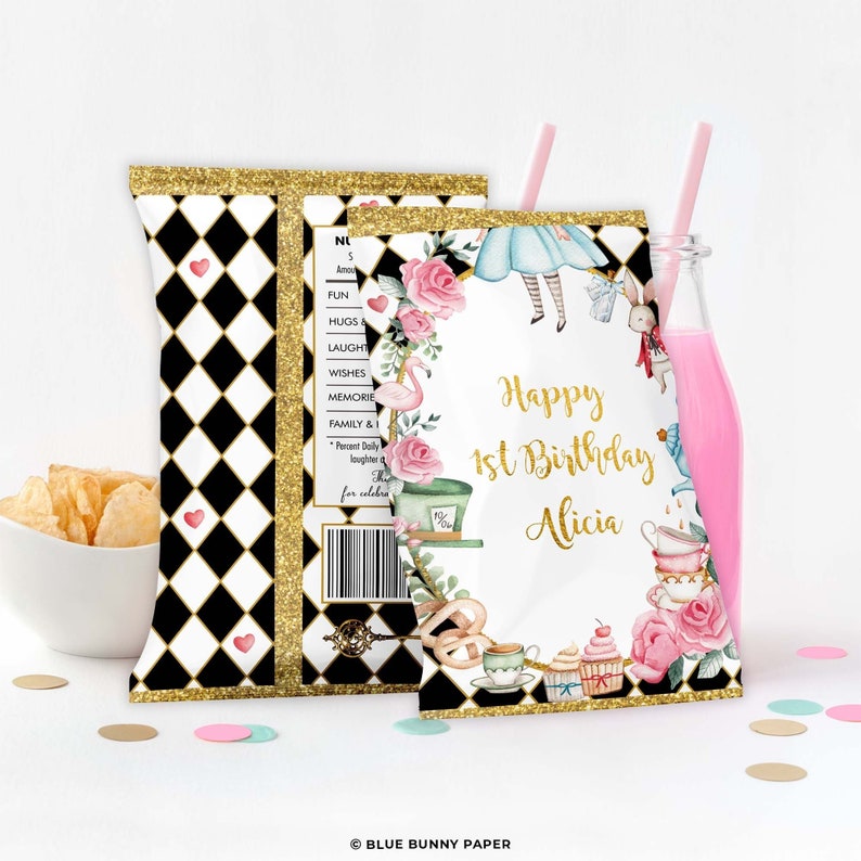 May include: A white chip bag with a black and white chequered pattern and gold glitter. The front of the bag features a whimsical illustration of Alice in Wonderland characters, including Alice, the Mad Hatter, the White Rabbit, and teacups. The text "Happy 1st Birthday Alicia" is printed in gold lettering.