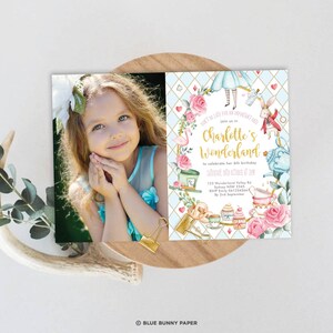 May include: Alice in Wonderland themed birthday party invitation with a photo of a young girl. The invitation features a blue and white chequered background with a pink flamingo, a white rabbit, and a teacup. The text on the invitation reads "Don't be late for an important date. Join us in Charlotte's Wonderland to celebrate her 6th birthday. Saturday, 10th October at 3pm. 123 Wonderland Valley Rd, Sydney NSW 2345. RSVP Emily 0412345667 by 2nd September."