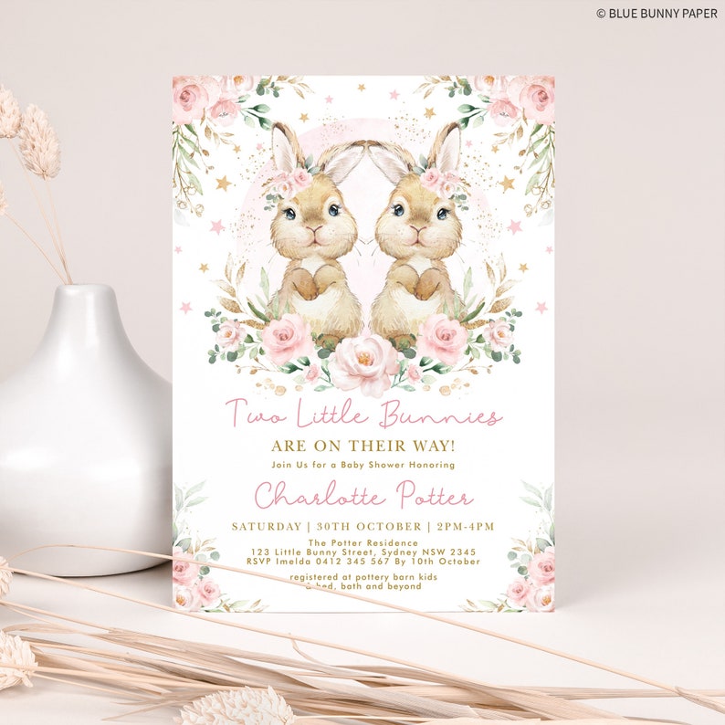May include: A pink and gold baby shower invitation with two bunnies wearing floral headbands. The invitation reads "Two Little Bunnies Are On Their Way!" and includes the name "Charlotte Potter".
