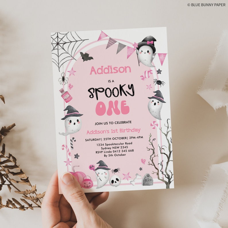 May include: Pink and white Halloween-themed first birthday party invitation with a ghost and bats. The invitation says "Addison is a Spooky One" and includes details for the party, including the date, time, and location.