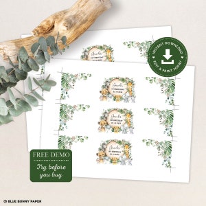 May include: Printable digital download of 8 favor tags featuring a jungle animal theme. The tags are decorated with a green leafy border and a circle with a wood grain texture. The circle features a variety of jungle animals including a lion, giraffe, monkey, elephant, and zebra. The text "Jacob's 1st Birthday" is printed in a brown font on the circle. The text "24.10.2020" is printed in a smaller brown font below the name.