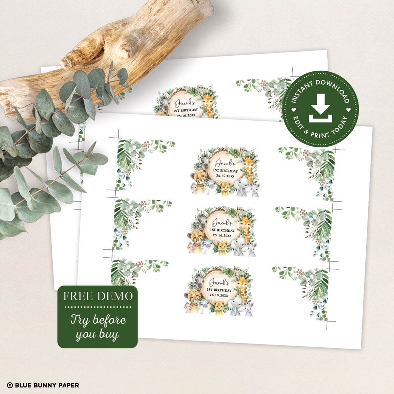 May include: Printable digital download of 8 favor tags featuring a jungle animal theme. The tags are decorated with a green leafy border and a circle with a wood grain texture. The circle features a variety of jungle animals including a lion, giraffe, monkey, elephant, and zebra. The text "Jacob's 1st Birthday" is printed in a brown font on the circle. The text "24.10.2020" is printed in a smaller brown font below the name.