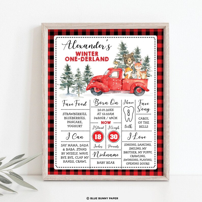 May include: A red and black buffalo plaid printable poster with a red truck and woodland animals. The poster is for a child's first birthday and includes the child's name, Alexander, and details about their first year, including their birthdate, weight, height, favorite foods, and activities. The poster also includes the text "Winter One-derland".