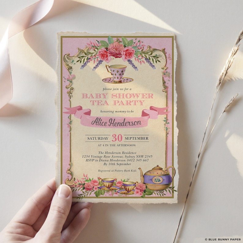 May include: Pink and gold baby shower tea party invitation with floral design and a teapot and teacups. The invitation says "Please join us for a Baby Shower Tea Party honouring mummy-to-be Alice Henderson. Saturday, 30th September at 4 in the afternoon. The Henderson Residence, 1234 Vintage Rose Avenue, Sydney NSW 2345. RSVP to Diana Henderson 0412 345 667 by 10th September. Registered at Pottery Bark Kids."