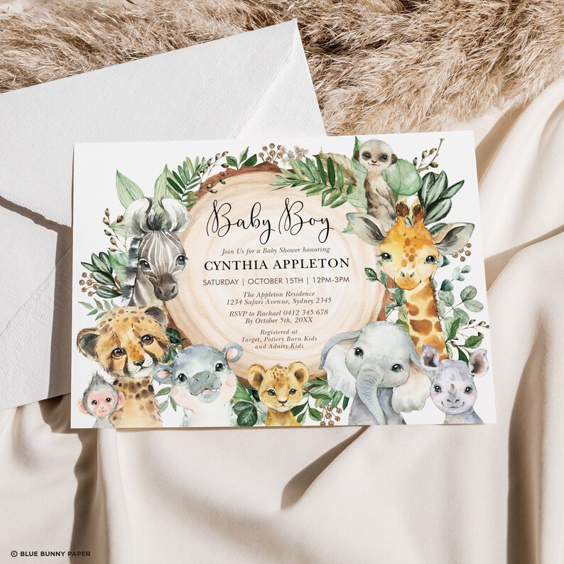May include: A baby shower invitation with a jungle theme. The invitation features a watercolor illustration of various animals, including a giraffe, zebra, cheetah, monkey, elephant, and hippopotamus. The text on the invitation reads "Baby Boy" and includes the name of the guest of honor, the date and time of the shower, and the address.