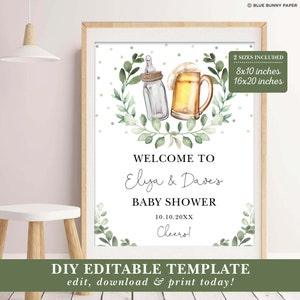 May include: A printable baby shower welcome sign with a green leafy wreath and a baby bottle and beer glass illustration. The text reads "Welcome to Eliza & Dave's Baby Shower 10.10.20XX Cheero!" and "DIY Editable Template edit, download & print today!"