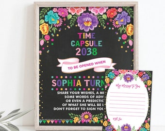 May include: A colorful time capsule sign with a floral border and the text "Time Capsule 2038" and "Sophia Turns..." with a smaller card that says "My message to you".