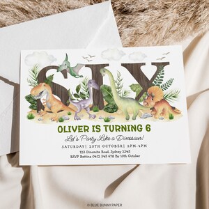 May include: A birthday invitation with a dinosaur theme. The invitation features the number six with dinosaurs surrounding it. The text reads "Oliver is turning 6, Let's Party Like a Dinosaur!" with the date, time, address, and RSVP information below.