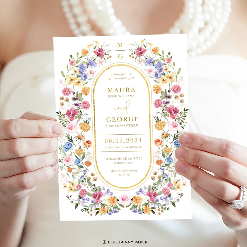 May include: A floral wedding invitation with a gold border and text that reads "Please join us for the wedding of Maura Rose Williams and George Carter Whitfield, 08.05.2024 at 4 o'clock in the afternoon, Domaine de la Rose, Sydney, NSW, dinner and dancing to follow."