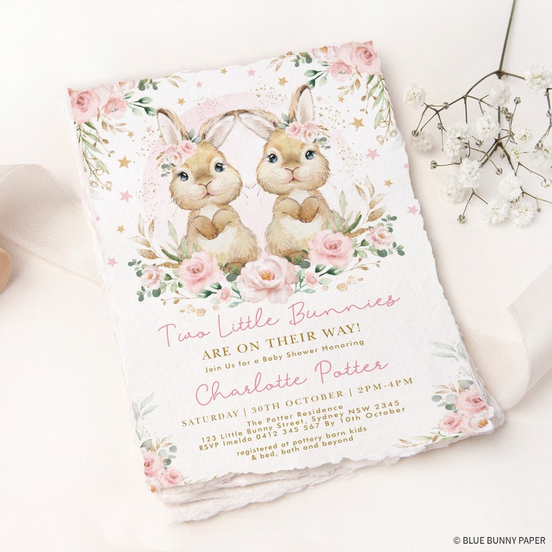 May include: A pink and gold baby shower invitation with a watercolor illustration of two bunnies wearing floral crowns. The text reads "Two Little Bunnies Are On Their Way!" and "Charlotte Potter".