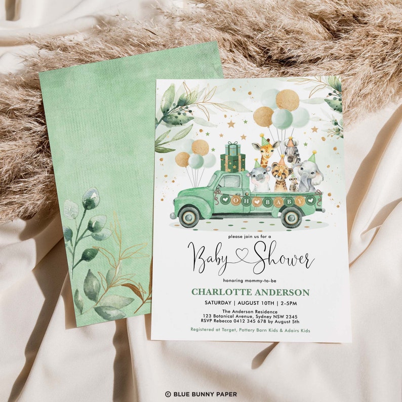 May include: A green and gold baby shower invitation with a cartoon illustration of a green truck carrying a giraffe, zebra, lion, and other animals. The text on the invitation reads "Please join us for a Baby Shower honoring mommy-to-be Charlotte Anderson. Saturday, August 10th, 2-5pm. The Anderson Residence, 123 Botanical Avenue, Sydney NSW 2345. RSVP Rebecca 0412 345 678 by August 5th. Registered at Target, Pottery Barn Kids & Adairs Kids. Blue Bunny Paper."