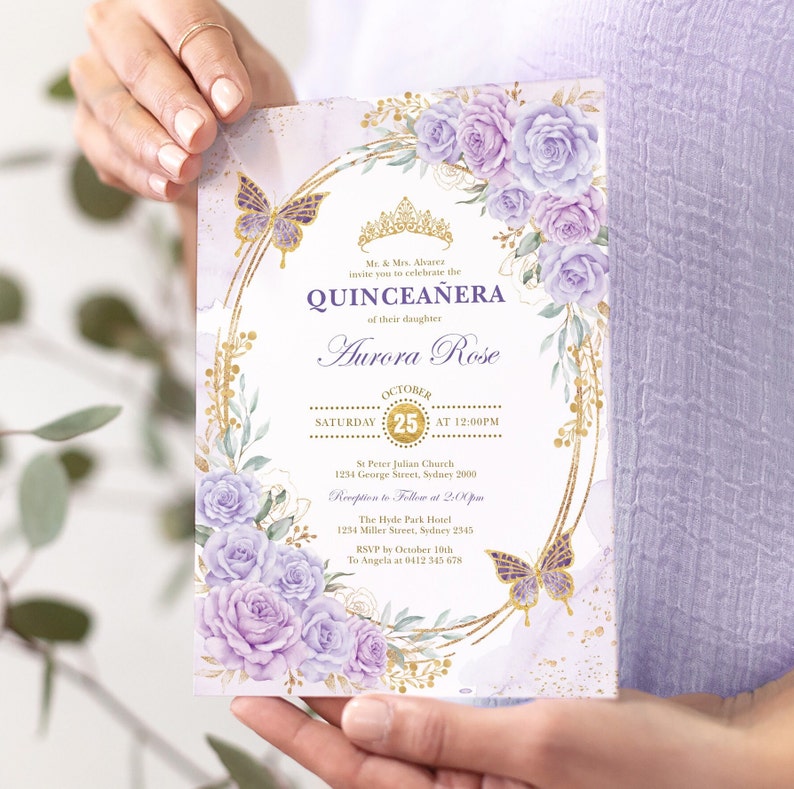 May include: Purple and gold Quincea&ntilde;era invitation with a floral design and butterflies. The invitation includes the name Aurora Rose, the date October 25th, and the time 12:00 PM. It also includes the location of the event, St. Peter Julian Church, and the reception location, The Hyde Park Hotel.