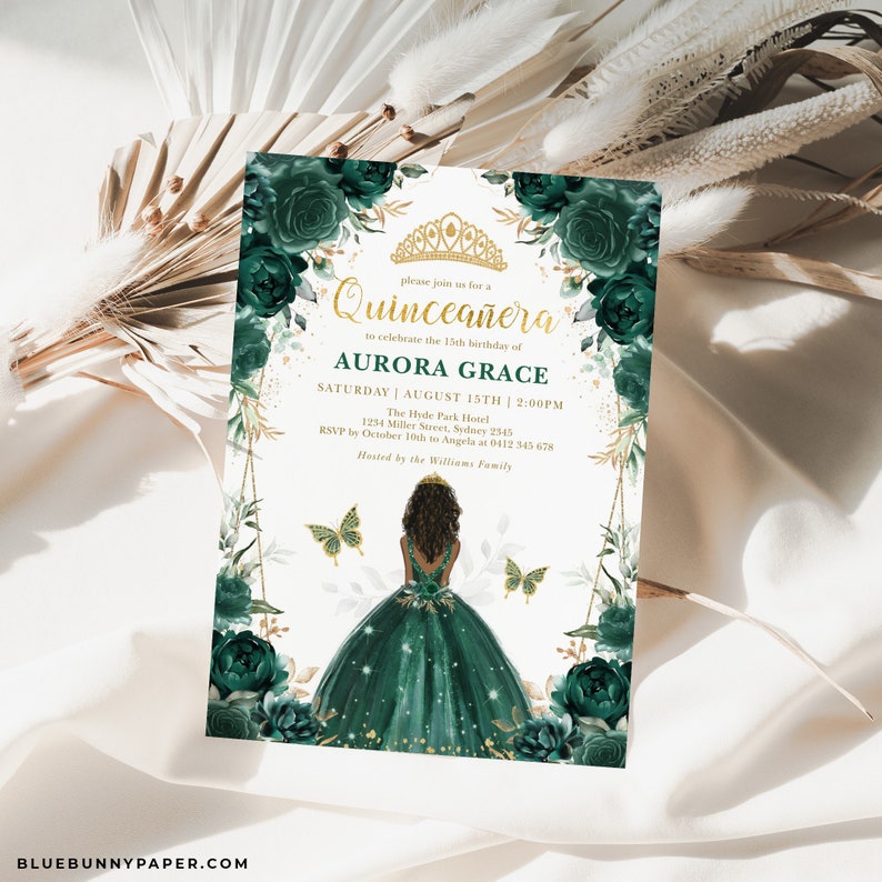 May include: A green and gold Quincea&ntilde;era invitation with a floral design and a silhouette of a girl in a green dress. The text reads "Please join us for a Quincea&ntilde;era to celebrate the 15th birthday of Aurora Grace. Saturday | August 15th | 2:00PM. The Hyde Park Hotel 1234 Miller Street, Sydney 2545. RSVP by October 10th to Angela at 0412 345 678. Hosted by the Williams Family."
