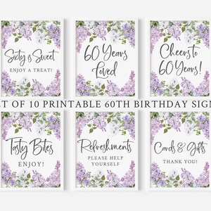 May include: Set of ten printable 60th birthday signs featuring a lilac floral design. The signs include the text "Sixty is Sweet", "60 Years Loved", "Cheers to 60 Years", "Tasty Bites", "Refreshments", and "Cards & Gifts".
