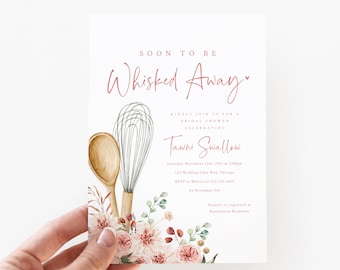 May include: A blush pink bridal shower invitation with a watercolor floral design and a whisk and wooden spoon. The text reads "Soon to be Whisked Away" and includes the bride's name, date, time, location, and RSVP information.