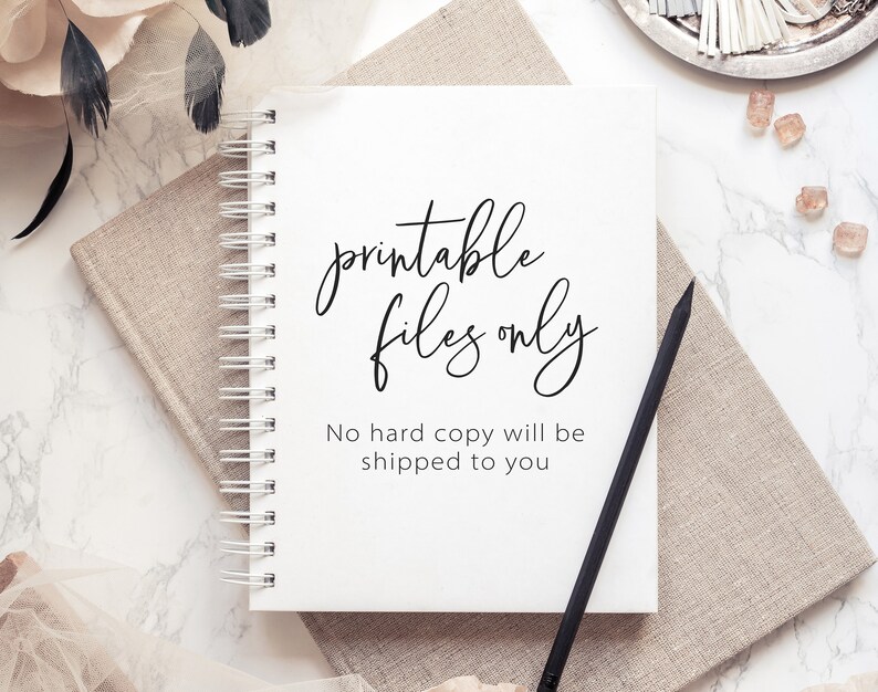 May include: A white notebook with a black spiral binding. The notebook has the text "printable files only" written in black cursive script. Below the text is the sentence "No hard copy will be shipped to you".