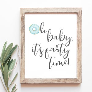 May include: A framed print with a blue and white donut illustration and the text "Oh baby, it's party time!"