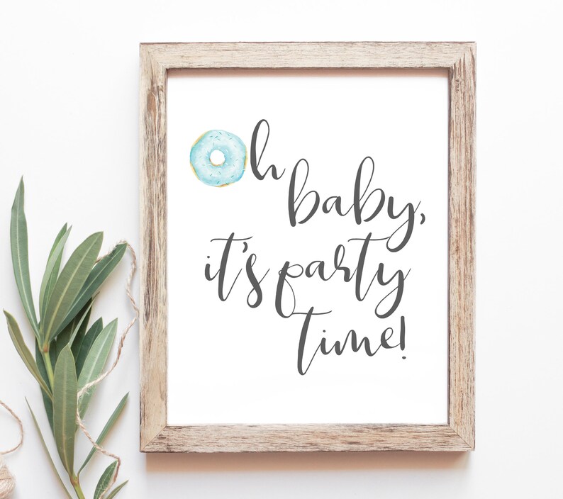 May include: A framed print with a blue and white donut illustration and the text "Oh baby, it's party time!"