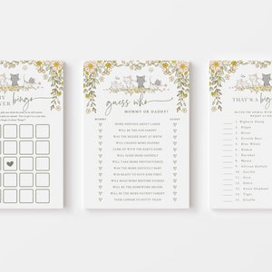 Op de afbeelding: Drie afdrukbare babyborrelspelkaarten met een bloemige rand en schattige kattenillustraties. De spellen zijn "Baby Shower Bingo", "Raad wie: Mama of Papa?" en "Dat is een grote baby".