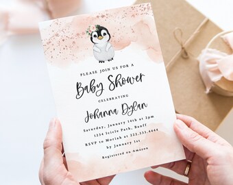 May include: A baby shower invitation with a watercolor background featuring a penguin wearing a flower crown. The invitation reads "Please join us for a Baby Shower celebrating Johanna Dylan. Saturday, January 14th at 2pm, 1234 Icicle Path, Banff. RSVP to Moriah at 222.333.4444 by January 1st. Registered on Amazon."