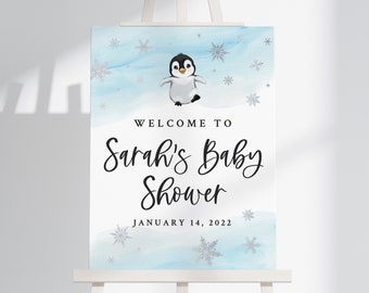 May include: Welcome to Sarah's Baby Shower sign with a penguin illustration on a blue and white watercolor background. The date is January 14, 2022.