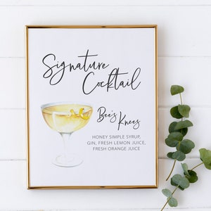 May include: A printable sign with a gold frame, featuring a watercolour illustration of a cocktail glass with a yellow drink and a lemon twist. The text reads "Signature Cocktail" and "Bee's Knees" with the ingredients listed below: "Honey simple syrup, gin, fresh lemon juice, fresh orange juice."