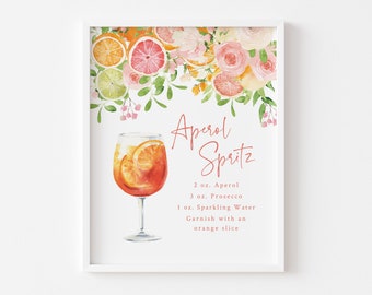 May include: A printable recipe card with watercolor illustrations of oranges, lemons, and pink flowers. The recipe card is for an Aperol Spritz cocktail and includes the ingredients: 2 oz. Aperol, 3 oz. Prosecco, 1 oz. Sparkling Water, and a garnish of an orange slice.