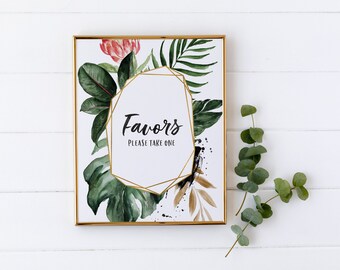 Può includere: Un cartello con cornice dorata, sfondo bianco e cornice geometrica dorata. Il cartello presenta un'illustrazione ad acquerello di foglie e fiori tropicali. Il testo sul cartello recita "Favors Please Take One".