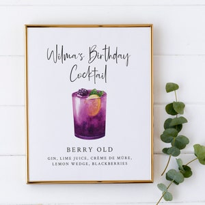 May include: A printable sign for a birthday party, featuring a watercolour illustration of a purple cocktail with blackberries, a lemon wedge, and a sprig of mint. The text reads "Wilma's Birthday Cocktail Berry Old Gin, Lime Juice, Cr&egrave;me de Mure, Lemon Wedge, Blackberries".