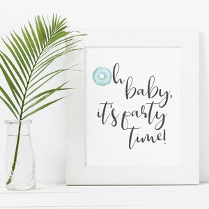 May include: White framed print with a blue donut graphic and the text "Oh baby, it's party time!"
