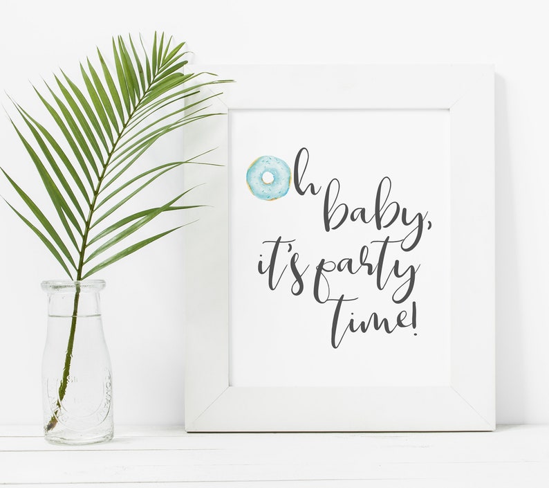 May include: White framed print with a blue donut graphic and the text "Oh baby, it's party time!"