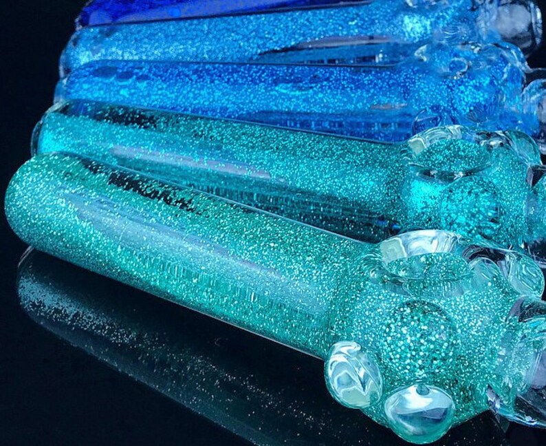 Glitter and liquid filled pipes with sparkle glitter that Etsy