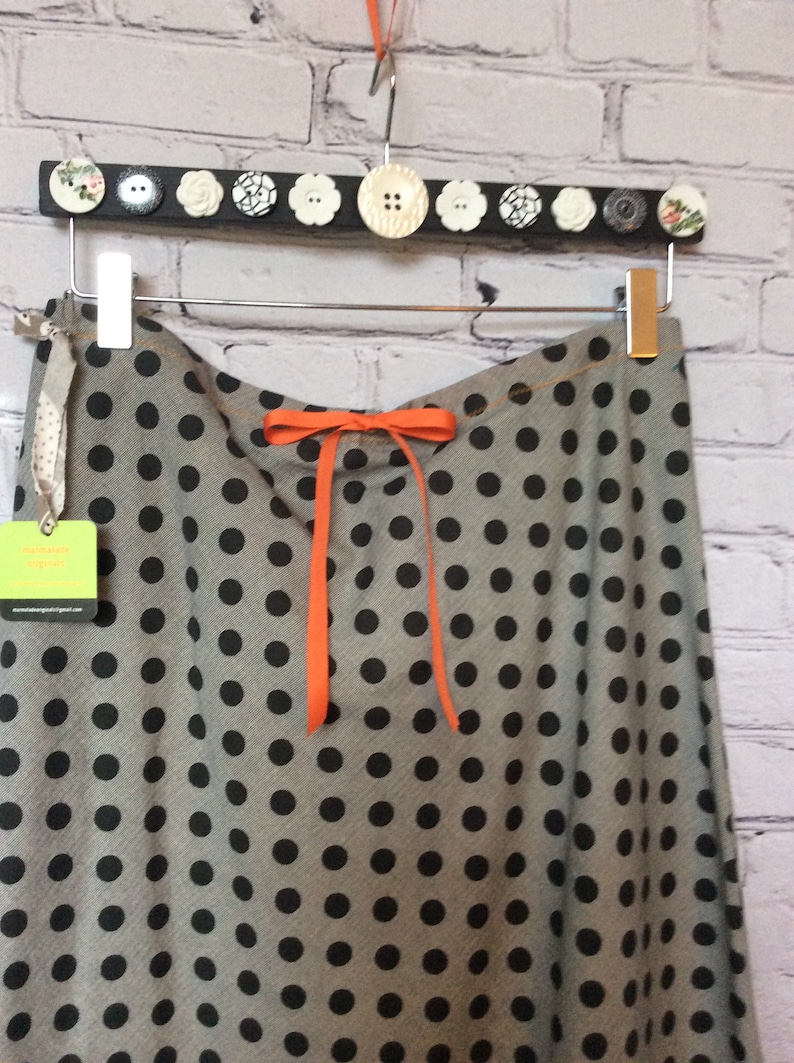 bias cut cotton skirt a-line black and gray background with black dots with sparrow embellishment.