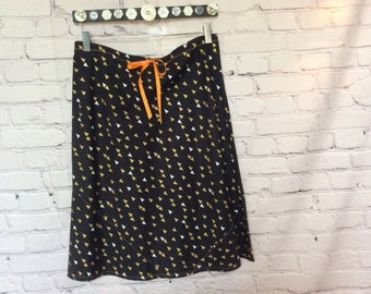 a-line, bias cut cotton skirt, black background with silver and gold triangles motif.  size 6, length options.