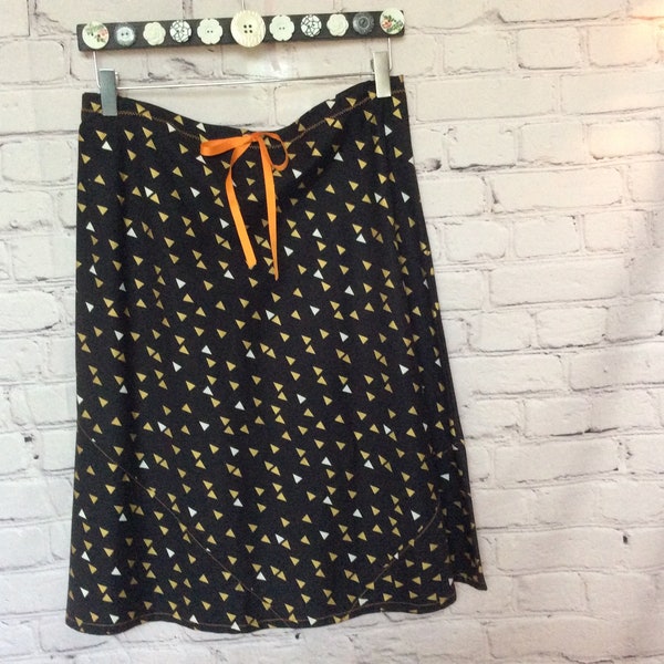 a-line, bias cut cotton skirt, black background with silver and gold triangles motif.  size 6, length options.