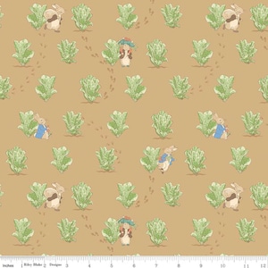 May include: A repeating pattern featuring illustrations of rabbits, lettuce, and footprints on a tan background. The rabbits are depicted in various poses, some wearing blue jackets. The lettuce is green, and the overall design has a whimsical, storybook feel.