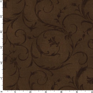 May include: Brown fabric with a dark brown floral scroll pattern. The design features swirling vines and stylized flower shapes. The fabric has a textured appearance, with a subtle variation in color across the surface.