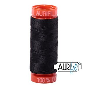May include: A spool of black thread with a red and white label that reads "Aurifil 100% Cotton".