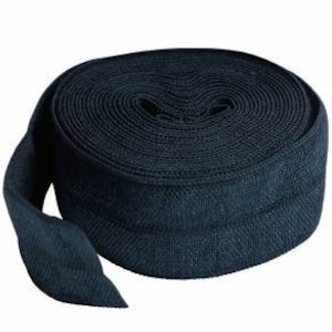 May include: A roll of dark blue elastic trim, perfect for adding a touch of stretch to your sewing projects.