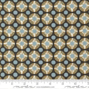 May include: A brown fabric with a repeating pattern of blue and gold circles. The circles have a starburst design in the center.