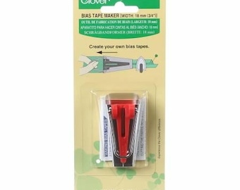 May include: Clover Bias Tape Maker, a red and silver tool for creating bias tape, with a width of 3/4 inch (18 mm). The packaging includes instructions for using the tool.