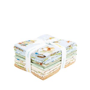 May include: A stack of fabric squares tied with a white ribbon. The fabric features a light blue background with illustrations of animals and other designs. The stack is composed of various colors and patterns, suitable for quilting or crafting projects.