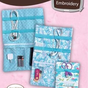 May include: Three blue and white fabric organizers with zippered pockets and elastic straps for holding cords and other small items. The organizers are labeled "Tech to Go Cord Caddies" and are described as "Folding accessory organizers in 4 sizes".