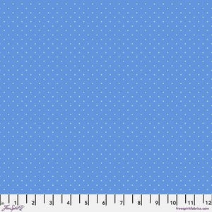 May include: A light blue fabric with a white polka dot pattern. The fabric is shown with a ruler for scale.