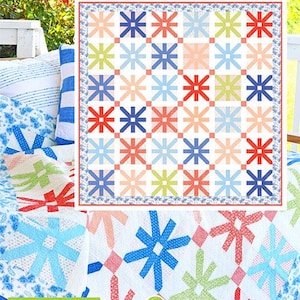 May include: A colorful quilt with a repeating starburst pattern in red, blue, green, and peach. The quilt is displayed on a white porch with pillows and other quilts. The text "Fireworks" is at the top.