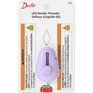 May include: A package for a Dritz LED Needle Threader. The package is white with orange and purple accents. The threader is a light purple color with a silver wire needle threader. The package includes a warning about ingestion hazards.