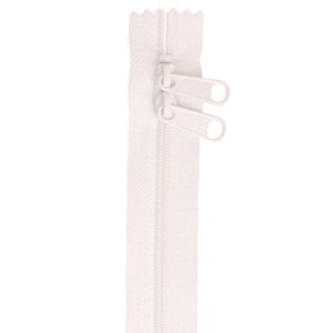 May include: White zipper with two white pull tabs.