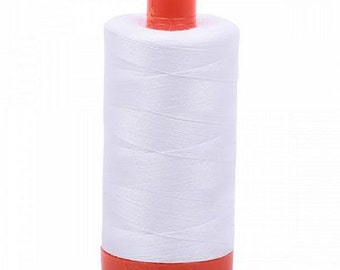 May include: A white spool of thread with an orange plastic top and bottom.